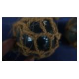 4 SMALL JAPENESE GLASS FISHING FLOATS, WITH 4 BOTTLES OF FIRE BRINE