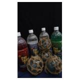 4 SMALL JAPENESE GLASS FISHING FLOATS, WITH 4 BOTTLES OF FIRE BRINE
