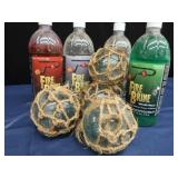4 SMALL JAPENESE GLASS FISHING FLOATS, WITH 4 BOTTLES OF FIRE BRINE