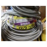 3 DIFFERENT SIZES OF CLAD CABLE (ELECTRICAL CONDUIT) AND YELLOW WIRES