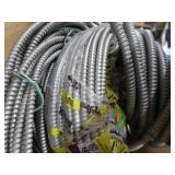3 DIFFERENT SIZES OF CLAD CABLE (ELECTRICAL CONDUIT) AND YELLOW WIRES