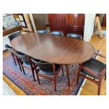 Beautiful Danish Rosewood Mid Century Modern Oval Dining Table & 8 Wood Chairs with Black Cushioned Seats and Backs