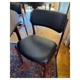 Beautiful Danish Rosewood Mid Century Modern Oval Dining Table & 8 Wood Chairs with Black Cushioned Seats and Backs