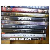 Collection of DVDs and VHS Tapes with Tower Cabinet