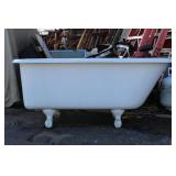 Vintage cast iron clawfoot bathtub, featuring a white porcelain enamel all over. 54" Long X 25.5" Wide X 23" High