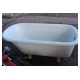 Vintage cast iron clawfoot bathtub, featuring a white porcelain enamel all over. 54" Long X 25.5" Wide X 23" High