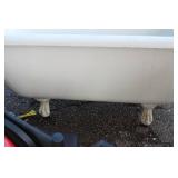 Vintage cast iron clawfoot bathtub, featuring a white porcelain enamel all over. 54" Long X 25.5" Wide X 23" High