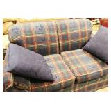 Plaid loveseat upholstered in navy, red, and green fabric. Approx. 57 Inch Long