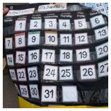 classroom information, posters, and slotted wall hangings