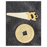 French 10 Centimes Coin and Asian-Inspired Coins with Miniature Saw and Chain