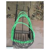 Hose on metal rack with sprayer