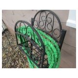 Hose on metal rack with sprayer