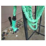 Hose on metal rack with sprayer