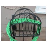 Hose on metal rack with sprayer