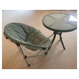Green Folding Chair with Cushioned Seat & Round Glass Table