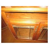 Wood entertainment center with glas...