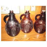 Trio of Amber tone water jugs with ...