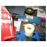 Machinist measuring and cutting too...