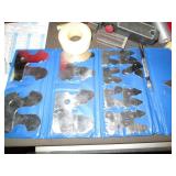 Machinist measuring and cutting too...