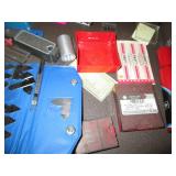 Machinist measuring and cutting too...