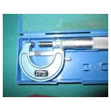 Machinist square, micrometer and mo...