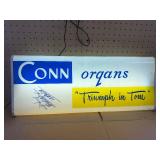 This vintage sign features branding for Conn organs, a prominent manufacturer of electronic organs