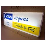This vintage sign features branding for Conn organs, a prominent manufacturer of electronic organs