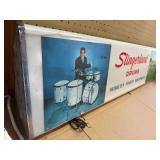 Vintage advertisement sign for Slingerland drums, historically manufactured in Chicago and Niles, Illinois
