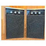 Both power on- Pair of This is a vintage Magnavox remote receiver speaker. It features control knobs for loudness, treble, and bass.