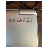 This item is a Sharper Image Portable DVD/Sound Soother (Model SI655)