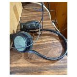 Grado iGrado behind-the-neck stereo headphones And assortment of wires and plugs.