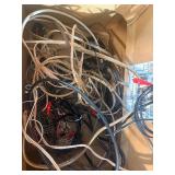 Grado iGrado behind-the-neck stereo headphones And assortment of wires and plugs.