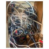 Grado iGrado behind-the-neck stereo headphones And assortment of wires and plugs.