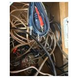 Grado iGrado behind-the-neck stereo headphones And assortment of wires and plugs.