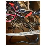 Grado iGrado behind-the-neck stereo headphones And assortment of wires and plugs.