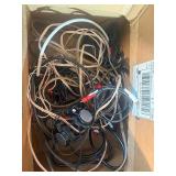 Grado iGrado behind-the-neck stereo headphones And assortment of wires and plugs.