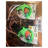 Grado iGrado behind-the-neck stereo headphones And assortment of wires and plugs.