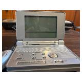 Sharper Image Design Travel Alarm plus RCA Disc player and ear phones.