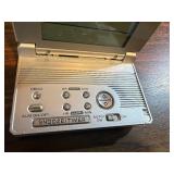 Sharper Image Design Travel Alarm plus RCA Disc player and ear phones.