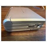 Sharper Image Design Travel Alarm plus RCA Disc player and ear phones.