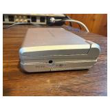 Sharper Image Design Travel Alarm plus RCA Disc player and ear phones.