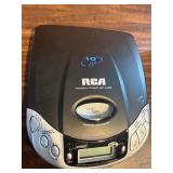 Sharper Image Design Travel Alarm plus RCA Disc player and ear phones.