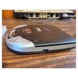 Sharper Image Design Travel Alarm plus RCA Disc player and ear phones.