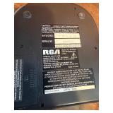 Sharper Image Design Travel Alarm plus RCA Disc player and ear phones.