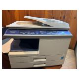 Sharp AL-2040CS desktop digital copier/printer powers on makes copies.