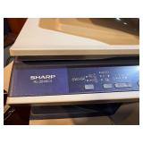 Sharp AL-2040CS desktop digital copier/printer powers on makes copies.
