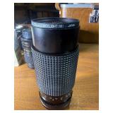 classic Canon AE-1 35mm film photography kit with several compatible accessories