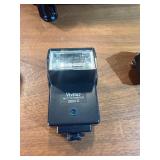 classic Canon AE-1 35mm film photography kit with several compatible accessories