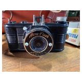 This vintage collectible is a Herold Acro-Flash bakelite miniature camera, manufactured by the Herold Manufacturing Company in Chicago, Illinois