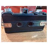 This vintage collectible is a Herold Acro-Flash bakelite miniature camera, manufactured by the Herold Manufacturing Company in Chicago, Illinois